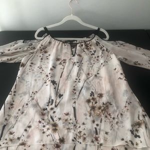 Beautiful White House Black Market shoulder revealing blouse.